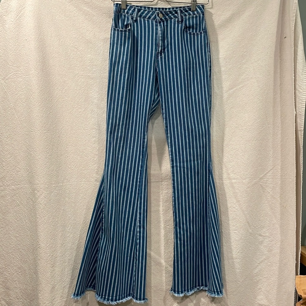 Women’s mid rise striped denim flare bell botttoms with a raw hem